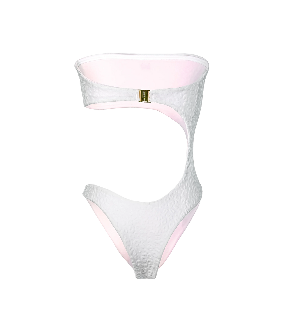 A back of white cut-out one-piece swimsuit with a textured leopard pattern and baby pink interior lining. The bandeau top connects to the bottom with a curved cutout. The bikini has a gold Wealthywet branded clasp at the back.