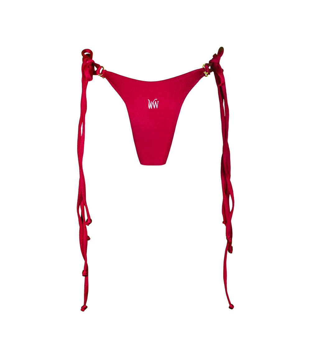 The back of a rich bordeaux colored swimwear bottoms with double tie strings on each side and gold branded rings hardware. The bikini bottoms are made from a shiny fabric and a have a white WW logo in the middle.