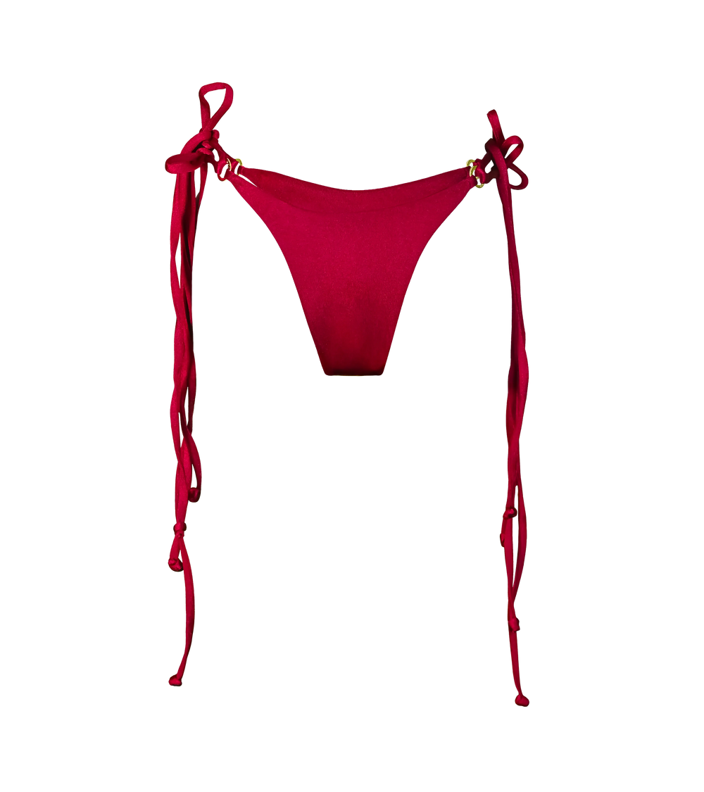 A rich bordeaux color tie down bikini bottoms. The swimwear bottoms have double tie strings with gold hardware branded rings on each side for customizable fit.