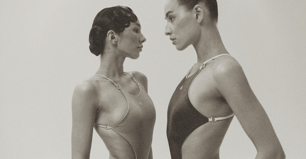 Models wearing a color pair of the Wealthywet 1925 swimsuits