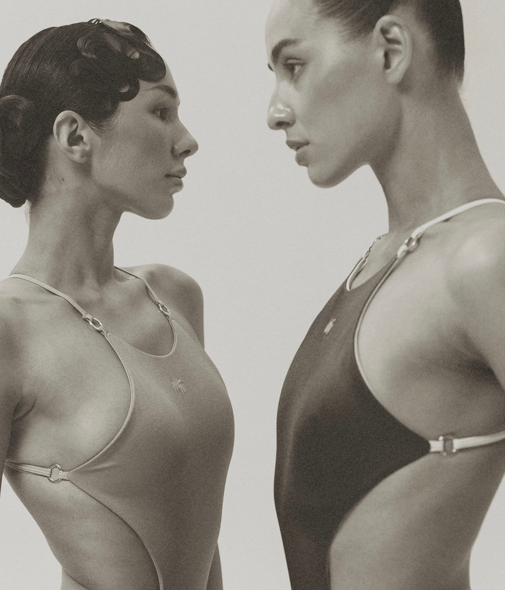 Models wearing a color pair of the Wealthywet 1925 swimsuits