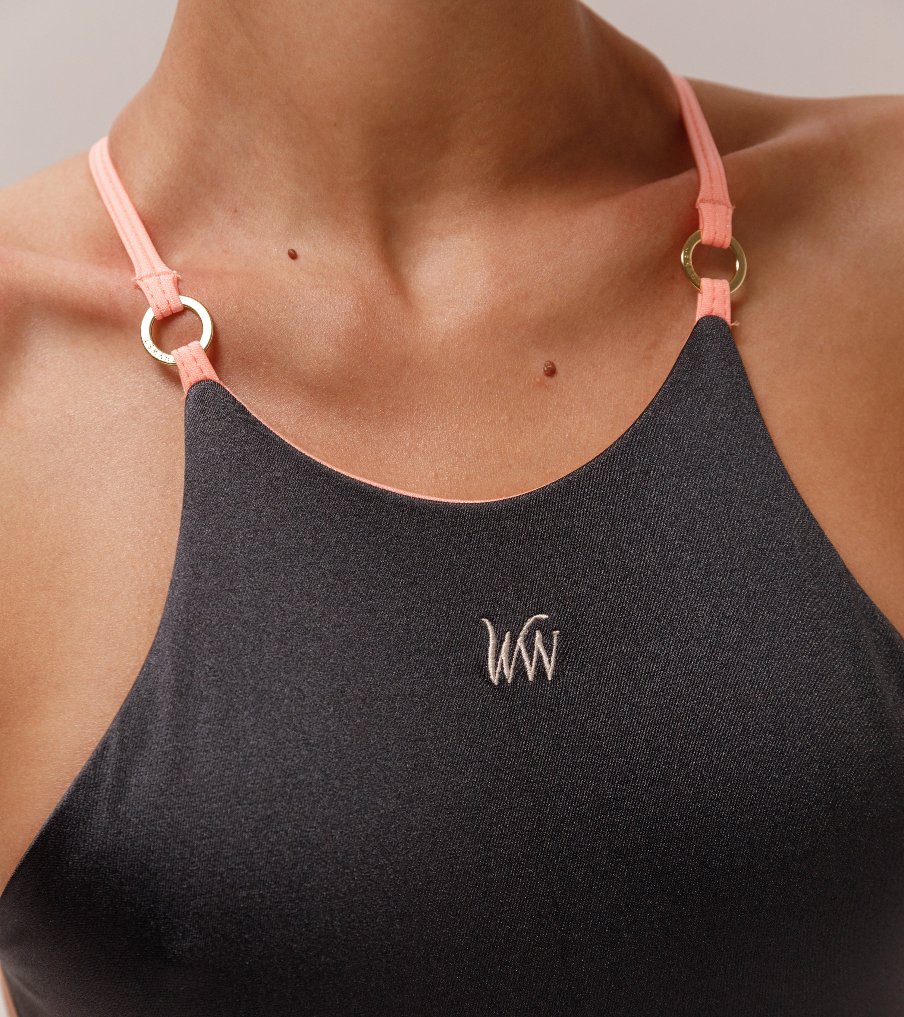 Close-up view of the Wealthywet logo 1925 one piece swimsuit in Chateau