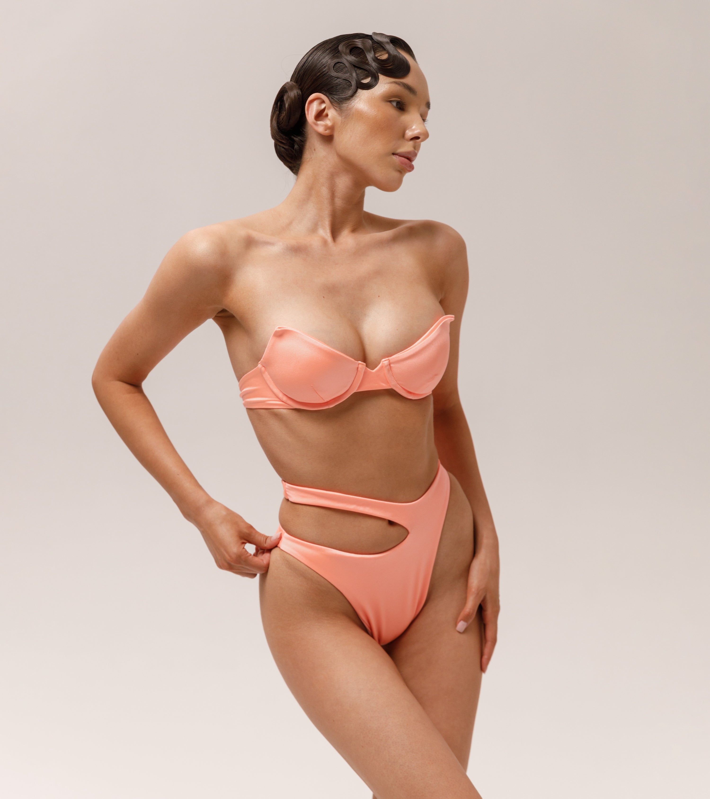 Model is wearing a Wealthywet 1966 swimsuit set in Flamenco