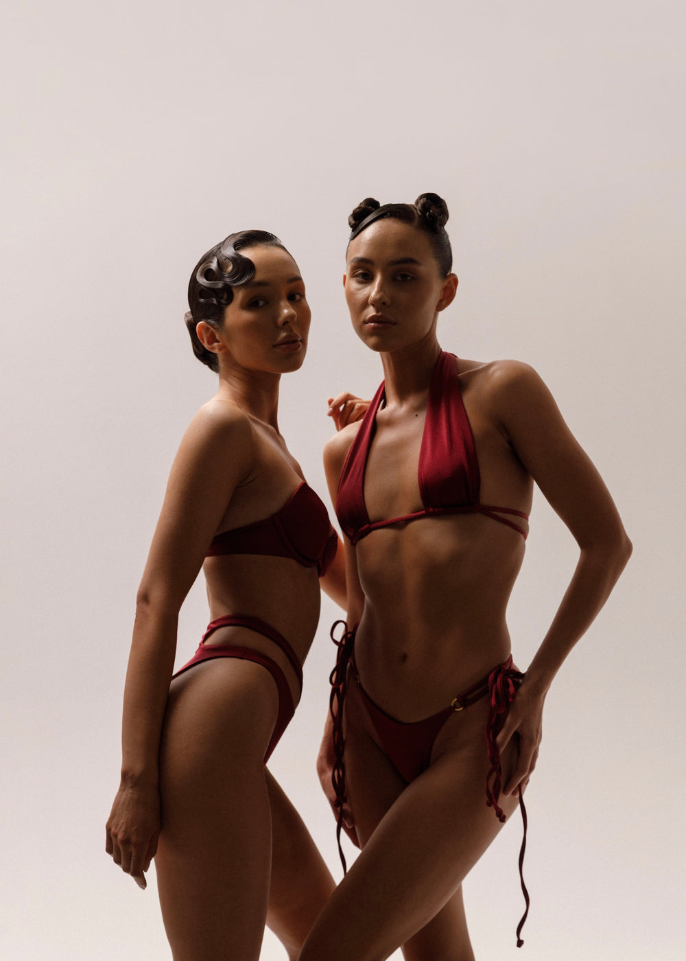 Models wearing Wealthywet 1994 and 1966 swimwear sets in Bordeaux